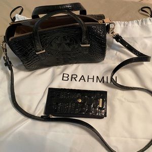 Small black leather crossbody with matching card holder.
